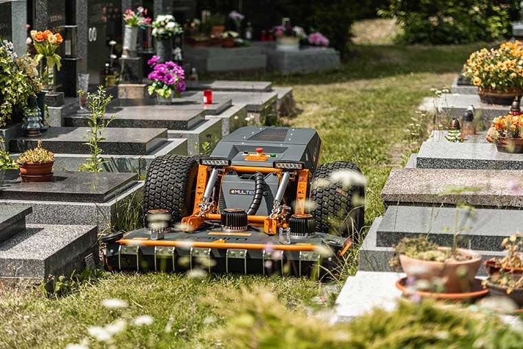 Raymo mowing in cemetery
