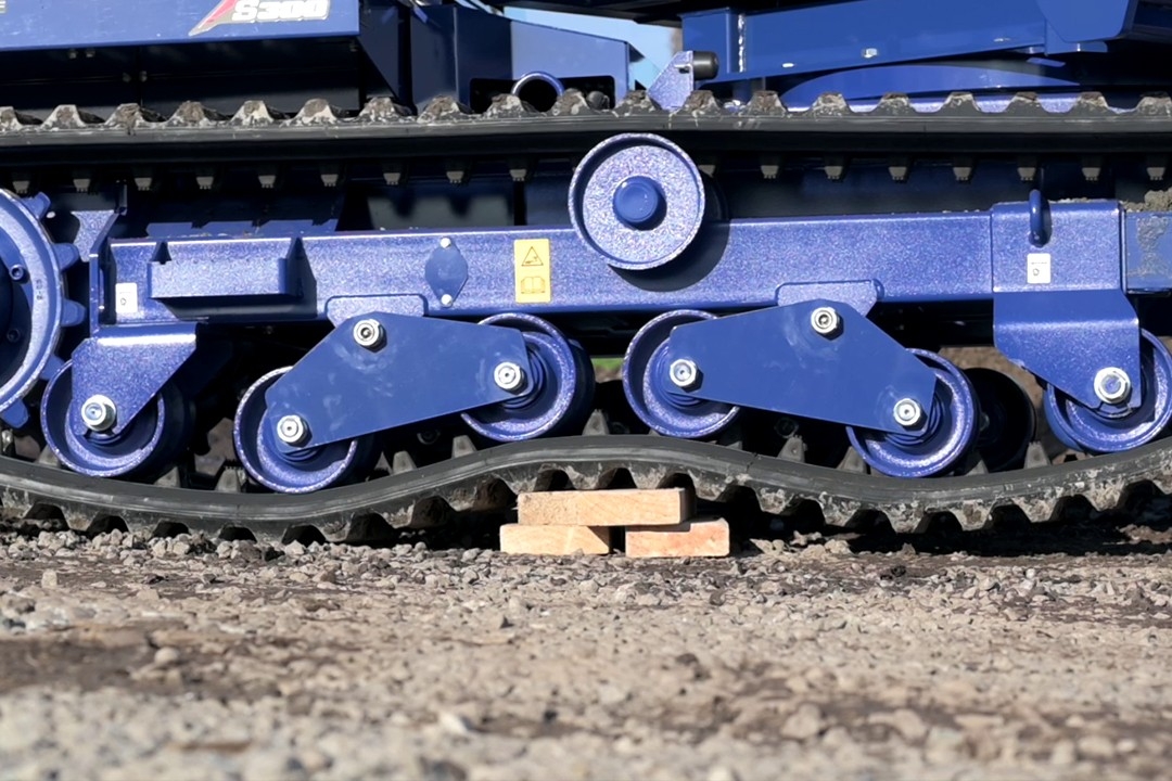 Pivoting track rollers for smooth ride