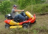 Male riding mower side view